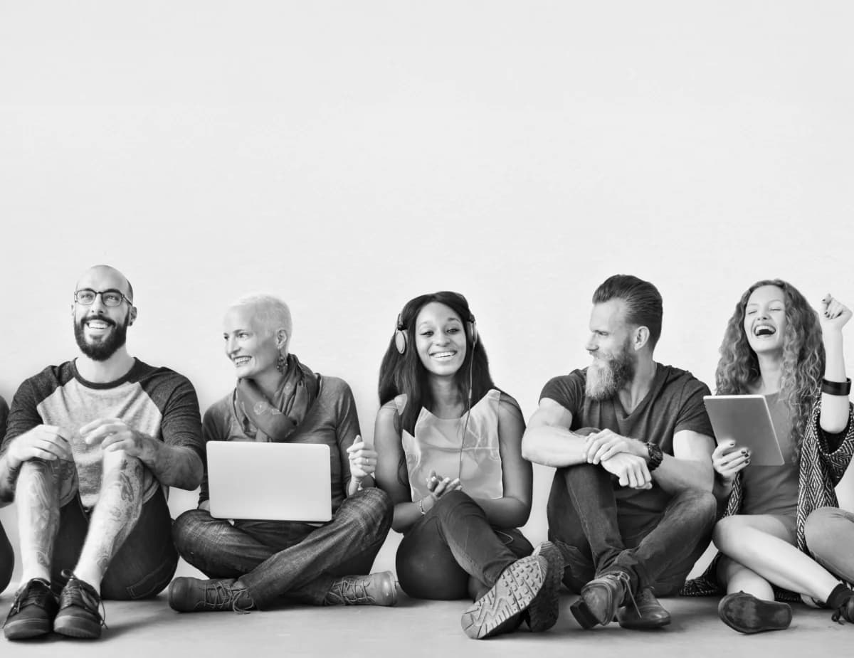 A team sitting together, laughing